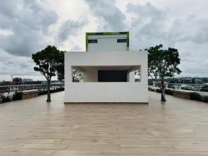 a white building on the top of a building at Villaggio Vista Furnished 3 bedroom room 1st Floor flat & Service room in Accra