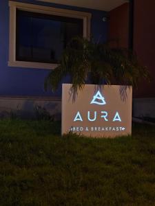 een bord voor een gebouw bij Aura B&B in Pachino