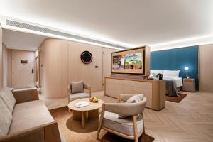 Uma área de estar em 西安高新锦业路桔子水晶酒店