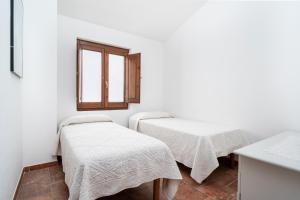 Postel nebo postele na pokoji v ubytování Domo Santu Jorji