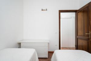 Postel nebo postele na pokoji v ubytování Domo Santu Jorji