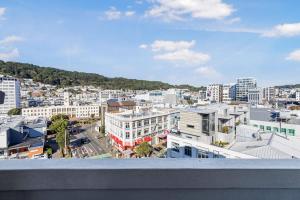 a view of a city from a balcony at 1BR Studio in Te Aro - City Lookout in Wellington
