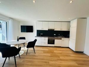 Kuchyň nebo kuchyňský kout v ubytování Bonnystay Lörrach l Balcony l Center l Design