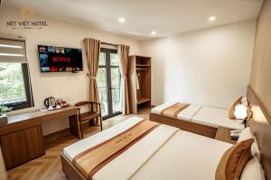 Postel nebo postele na pokoji v ubytování Nét Việt Hotel Vincom Sóc Trăng