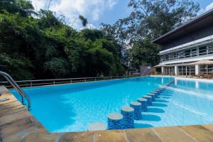 a large swimming pool with blue water at Riverside Park Complex in Nairobi