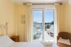 Ένα ή περισσότερα κρεβάτια σε δωμάτιο στο Surf Edu +23 φωτογραφίες