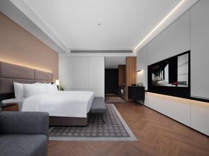 Televiisor ja/või meelelahutuskeskus majutusasutuses Intercity Hotel South Central Taiyuan