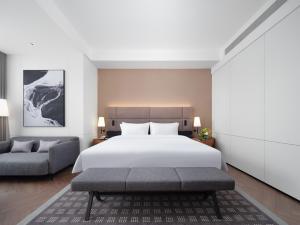Voodi või voodid majutusasutuse Intercity Hotel South Central Taiyuan toas