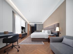 Voodi või voodid majutusasutuse Intercity Hotel South Central Taiyuan toas