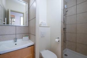 a bathroom with a sink and a toilet and a shower at Résidence Pierre & Vacances La Forêt in Flaine
