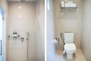 a bathroom with a toilet and a shower in it at Heritage Collection on Boon Tat in Singapore