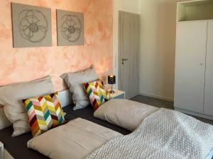 a bedroom with two pillows sitting on the floor at Hotel und Ferienwohnungen Nebauer in Frontenhausen