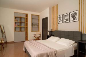 a bedroom with a large bed in a room at Sammit holiday home in Modica +59 photos