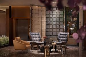 Ein Sitzbereich in der Unterkunft Baichuan Business Hotel, Haizhu District, Guangzhou