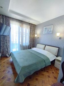 Postel nebo postele na pokoji v ubytování Davka Apartments