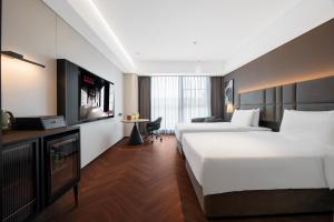 Xi'an Ancient Ming City Wall Premium IntercityHotel客房内的一张或多张床位