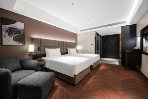 Xi'an Ancient Ming City Wall Premium IntercityHotel客房内的一张或多张床位