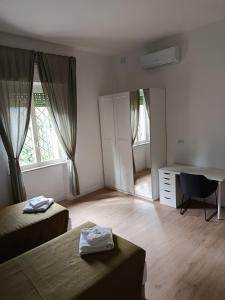 Postel nebo postele na pokoji v ubytování Residenza Cimone