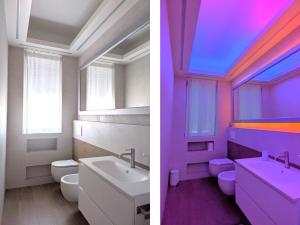 un bagno con lavandino e WC e soffitto colorato di Relax in Milano - Ventura - Lambrate - Città Studi a Milano