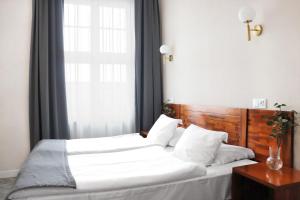 Posteľ alebo postele v izbe v ubytovaní Hotel Piast Wrocław Centrum