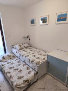 Postel nebo postele na pokoji v ubytování Apartments Rede