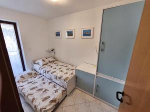 Postel nebo postele na pokoji v ubytování Apartments Rede