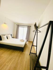 Postel nebo postele na pokoji v ubytování Canaan Hôtel Antsirabe