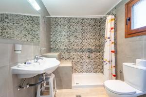 a bathroom with a sink and a toilet and a shower at Maria Apartments in Pefki Rhodes