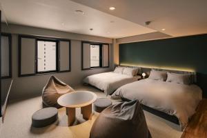 Postel nebo postele na pokoji v ubytování BASE LAYER HOTEL Nagoya Nishiki + 37 fotografií