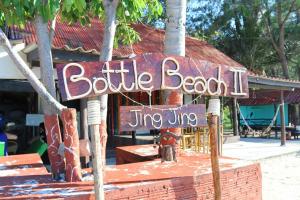 a sign that reads bottle beach jime lvl at Bottle Beach 2 Bungalows in Bottle Beach