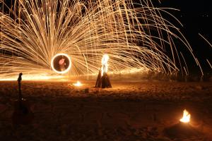 a fire show on the beach with fireworks at Bottle Beach 2 Bungalows in Bottle Beach