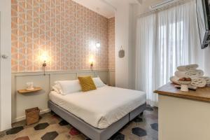 Postel nebo postele na pokoji v ubytování 101 Flats Candia's Suites