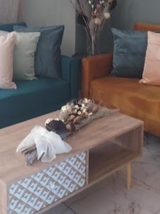 a living room with a coffee table and a couch at Duba Apartments 1 in Alexandroupoli