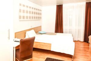 Ein Bett oder Betten in einem Zimmer der Unterkunft Gasthof Linde