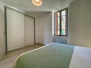 Postel nebo postele na pokoji v ubytování L'appartement Littré
