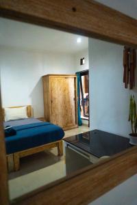 Postel nebo postele na pokoji v ubytování Naughty Nest Hostel Bali