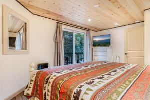 a bedroom with a bed and a window at Play Arcade Games Make Firepit Smores Explore Downtown Blue Ridge in Minutes - Trails End in Blue Ridge