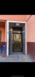 a door to a building with gold bars on it at Les Jardins Anass 1 aéroport Marrakech in Marrakesh
