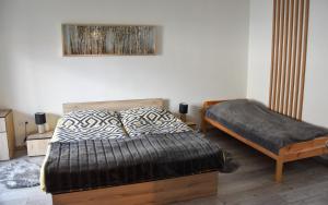 A bed or beds in a room at Apartmán u Braňa
