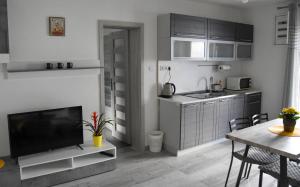 A kitchen or kitchenette at Apartmán u Braňa