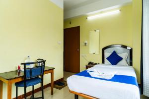 HOTEL NILADRII GALAXY客房内的一张或多张床位