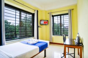 HOTEL NILADRII GALAXY客房内的一张或多张床位