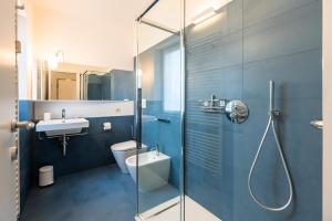 a bathroom with a shower and a toilet and a sink at La Torretta Panorama in Bergamo +42 photos