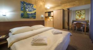 Posteľ alebo postele v izbe v ubytovaní Tatragolf Mountain Resort