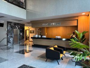 a lobby of a hotel with a reception desk at Sırma Hotel - All Inclusive in Side