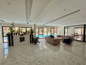 a large living room with couches and a pool at SA Apartments! Mahmutlar, 300m to the Beach in Alanya +33 photos
