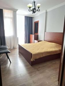 Ένα ή περισσότερα κρεβάτια σε δωμάτιο στο Sunshine Batumi
