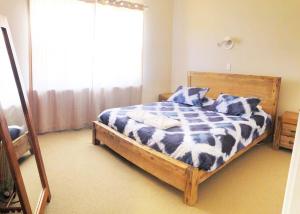 Ένα ή περισσότερα κρεβάτια σε δωμάτιο στο 3 Bedroom Home