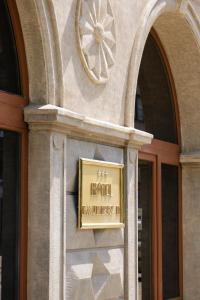 a hotel sign on the side of a building at Hotel Kazimierz II in Krakow
