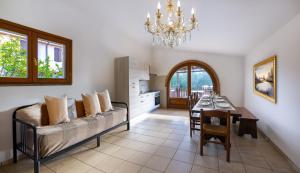 a living room with a couch and a dining room at Podere Santo Signoretto in San Vincenzo